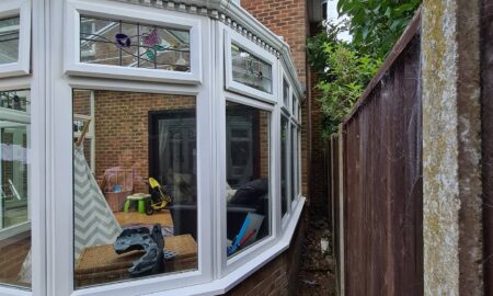 Exterior painting and decorating work on brick house with conservatory by Lord Heart Decorating Services
