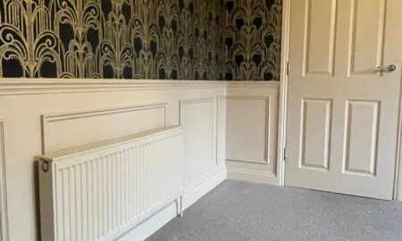 Interior space with bold wallpaper and expertly sprayed woodwork in Great Dunmow, Essex by Lord Hart Decorating