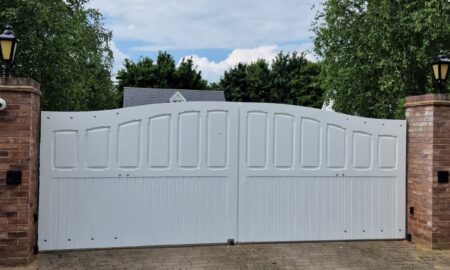 Re-sprayed white driveway gate with brick pillars by Lord Hart Decorating