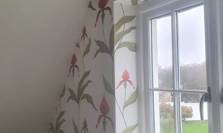 Feature wallpaper installation in a utility room by Lord Hearts Decorating Services with botanical design and precise finish