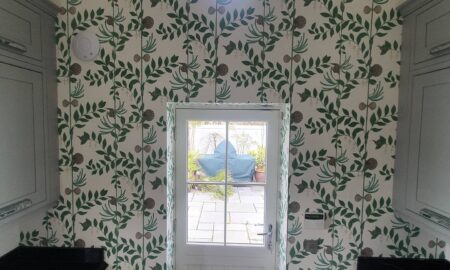 Feature wallpaper installation in a utility room by Lord Hearts Decorating Services with botanical design and precise finish in Little Waltham, Chelmsford, Essex