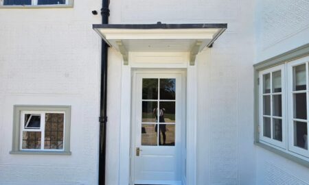 Fresh exterior door and wall paintwork by Lord Hearts Decorating Services on a period property.